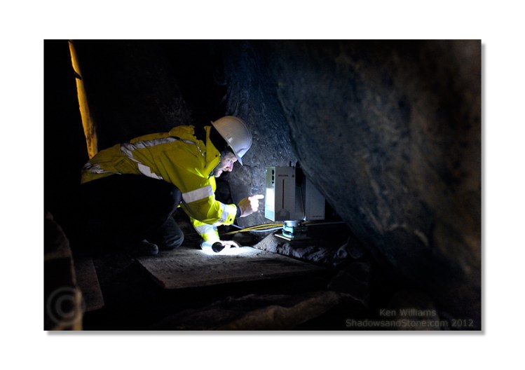 Marcus checks the settings on the scanner before it begins a 360° scan of the chamber and passage.