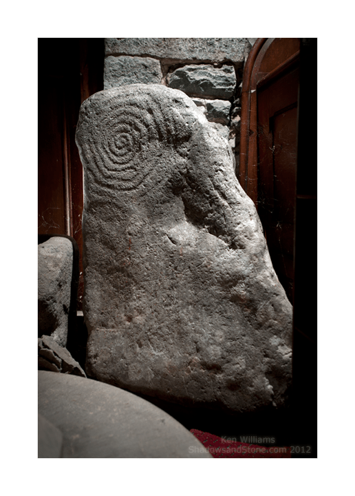 Llanbedr Spiral Stone The full face of the stone showing the decoration on the top left.
