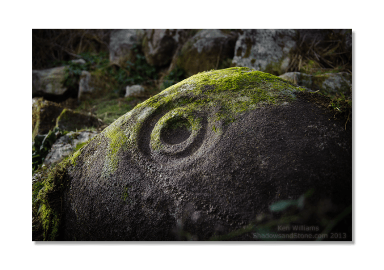 Not spotted while I was photographing the stone, some possible carving, an inverted U shape with cup mark, is just visible to the left of the main cup and ring motif.